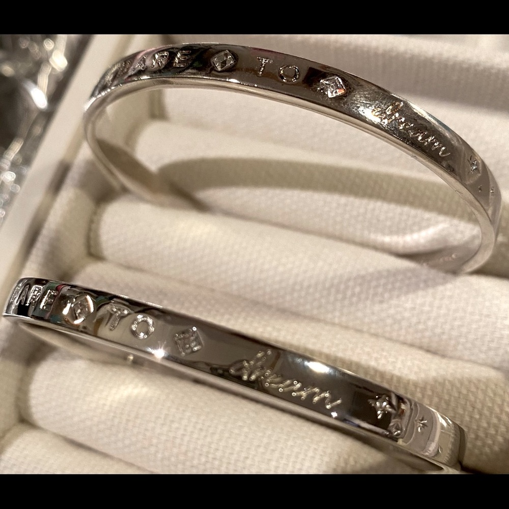 Dare to Dream bracelet, one size fits most.  Silver with two CZ stones.